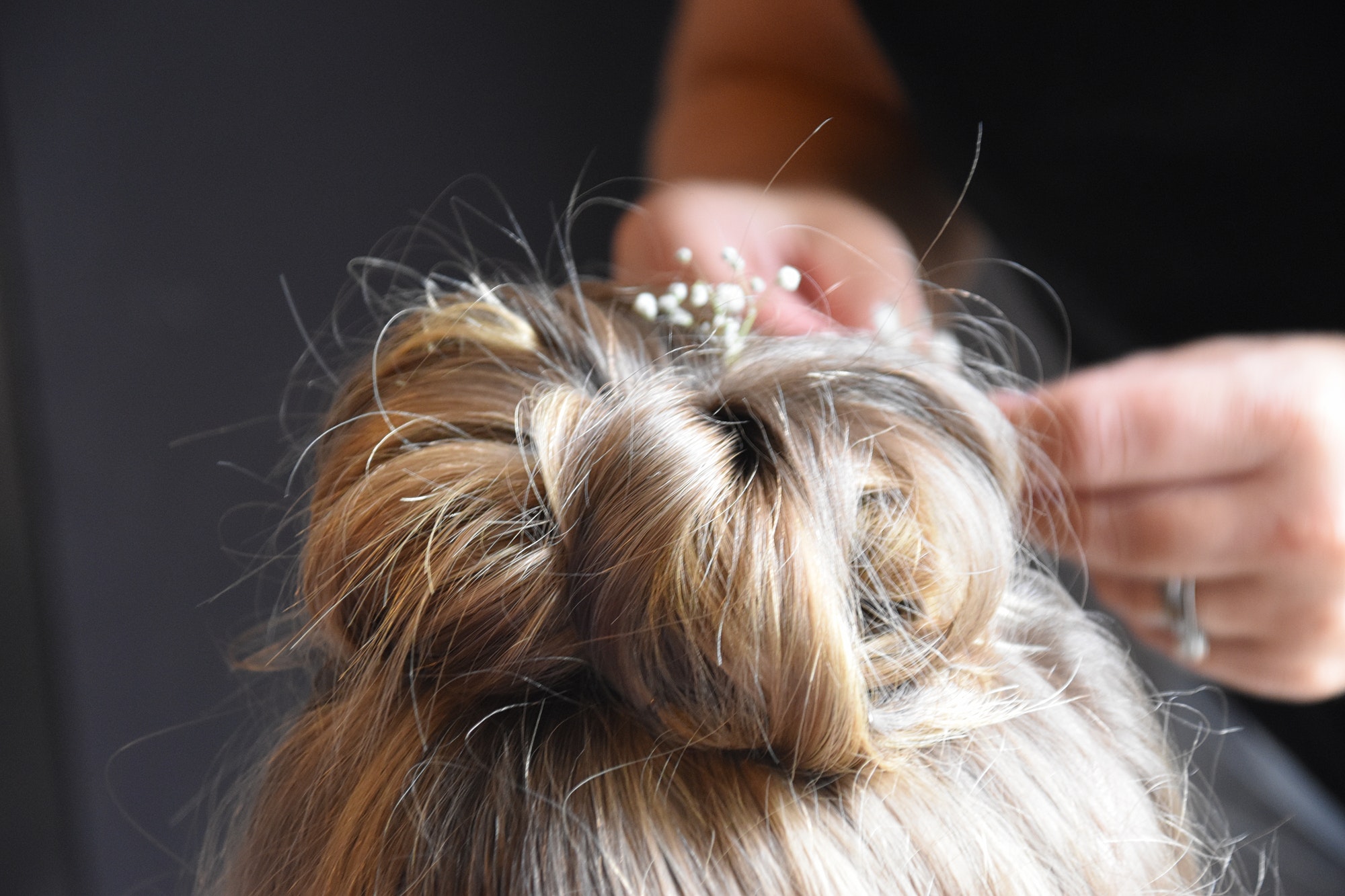 detail of wedding hair style for a flower girl